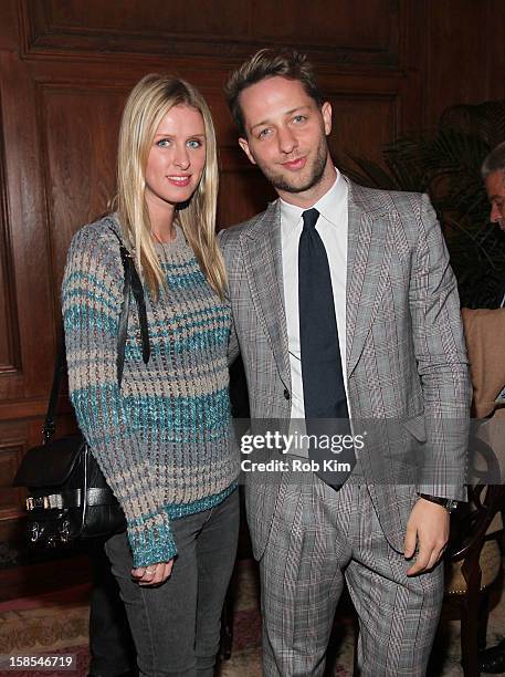 Derek Blasberg and Nicky Hilton attend the Derek Blasberg for Opening Ceremony Stationery launch party at the Saint Regis Hotel on December 18, 2012...