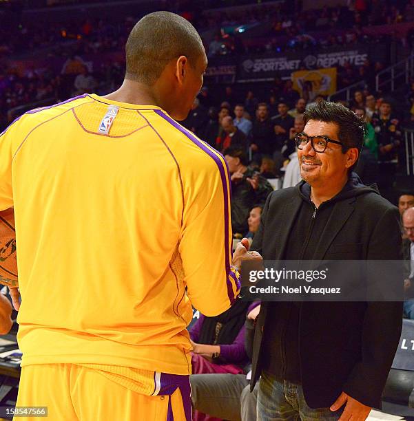 George Lopez talks to Metta World Peace at a basketball game between the Charlotte Bobcats and the Los Angeles Lakers at Staples Center on December...