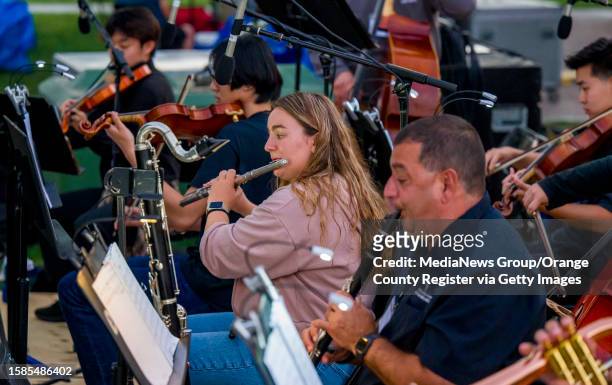 The orchestra plays during a dress rehearsal for The Tustin Area Council for Fine Arts 2023 Broadway in the Park production of Rodgers &...
