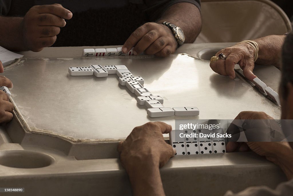 Men enjoying dominos