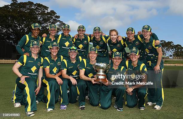 The Australian team poses with the Rose Bowl after winning game four of the Women's One-day International series between the Australian Southern...