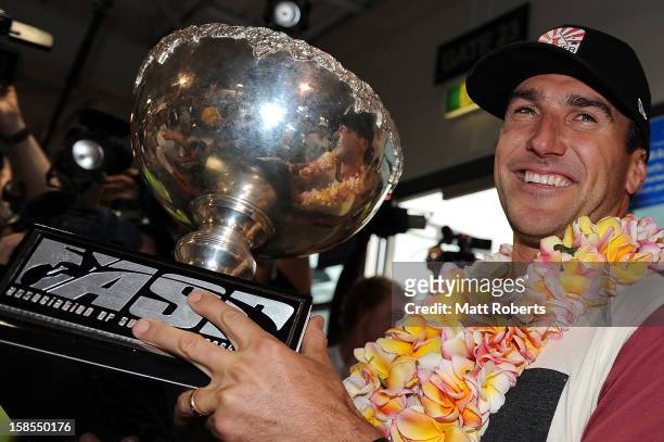 Australian surfer Joel Parkinson arrives home at the Gold Coast airport on December 19, 2012 on the Gold Coast, Australia. Parkinson won the Pipeline...