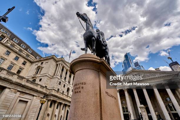 low angle view looking east towards the royal exchange and  glass and steel office buildings in the city of london england uk. - charles wellesley 9th duke of wellington stock pictures, royalty-free photos & images