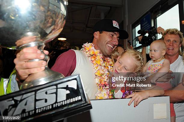 Australian surfer Joel Parkinson arrives home at the Gold Coast airport on December 19, 2012 on the Gold Coast, Australia. Parkinson won the Pipeline...