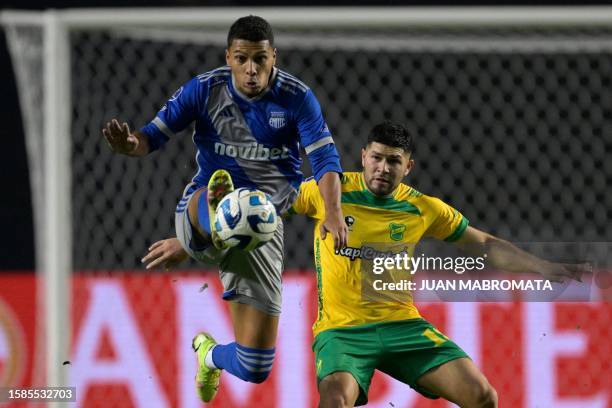 Emelec's defender Luis Leon and Defensa y Justicia's forward David Barbona fight for the ball during the Copa Sudamericana round of 16 second leg...