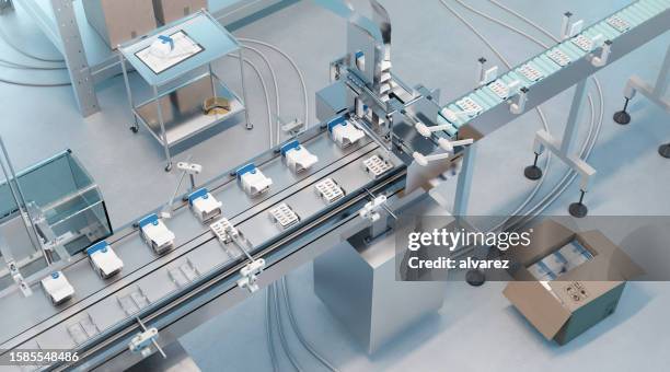 vista de alto ángulo de la cinta transportadora de la línea de envasado automatizada en una fábrica farmacéutica - fármaco fotografías e imágenes de stock