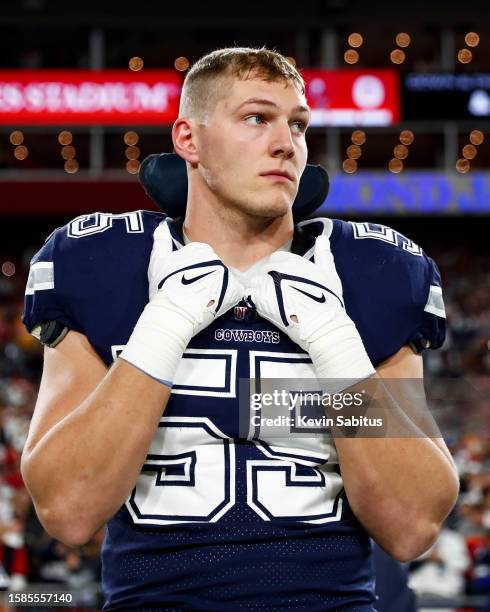 Leighton Vander Esch of the Dallas Cowboys stands on the sidelines during the national anthem prior to an NFL wild card playoff football game against...