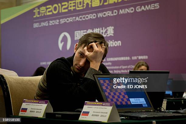 Chess player Alexander Grischuk of Russia prepares to compete in a 'blinfold' chess tournament at the Beijing 2012 World Mind Games Tournament in...