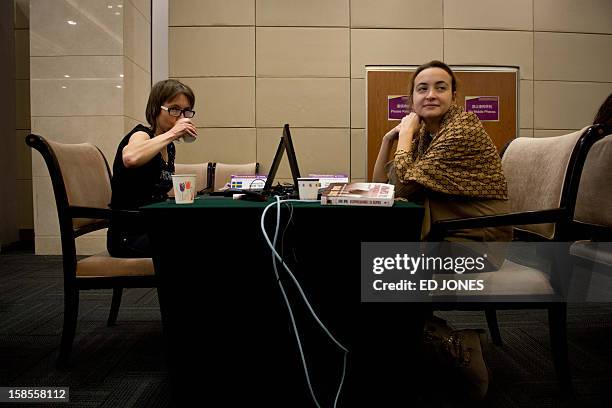 Chess players Pia Cramling of Sweden prepares to compete against Antoaneta Stefanova of Bulgaria in a 'blinfold' chess tournament at the Beijing 2012...