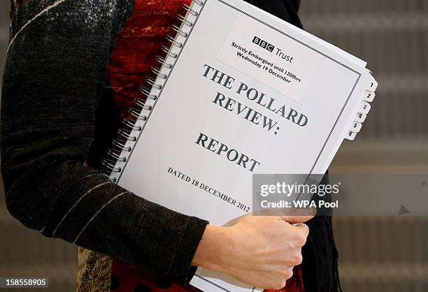 Journalist holds a copy of The Pollard Report at New Broadcasting House, Portland Place, on December 19, 2012 in London, England. The BBC Trust has...