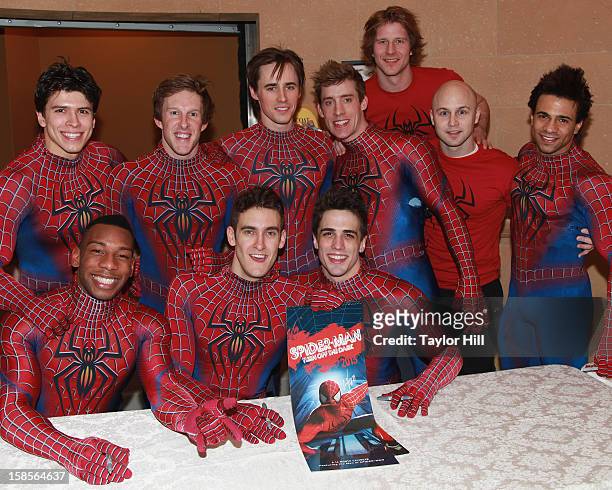 Actor Reeve Carney and the Spider-Man stunt doubles sign copies of the "Spider-Man: Turn Off the Dark" Broadway Calendar for Broadway Cares at...