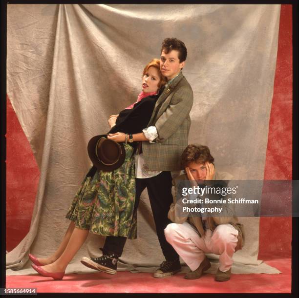 Molly Ringwald, Jon Cryer and Andrew McCarthy pose in costume on set for Pretty in Pink in Los Angeles in 1986.