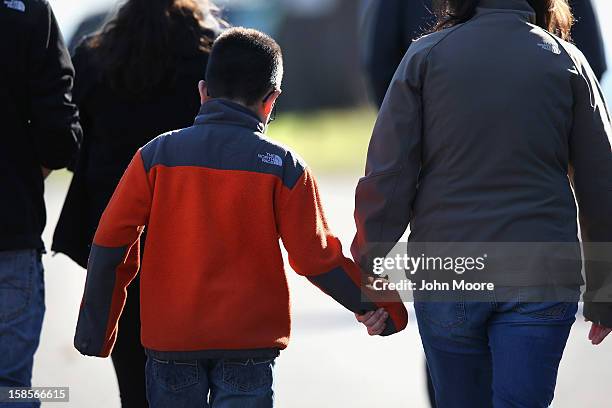 Mourners depart the funeral of slain teacher Victoria Soto at the Lordship Community Church on December 19, 2012 in Stratford, Connecticut. The first...