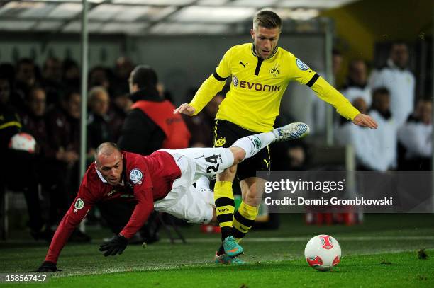 Christian Pander of Hannover and Jakub Blaszczykowski of Dortmund battle for the ball during the DFB Cup match between Borussia Dortmund and Hannover...