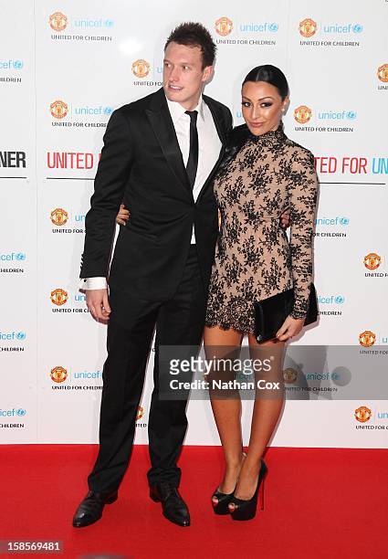 Phil Jones and Kaya Hall attend the United for UNICEF Gala Dinner at Old Trafford on December 19, 2012 in Manchester, England.
