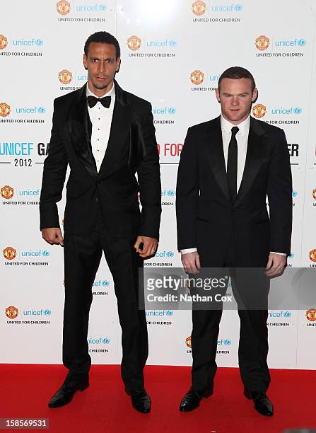 Rio Ferdinand and Wayne Rooney attends the United for UNICEF Gala Dinner at Old Trafford on December 19, 2012 in Manchester, England.