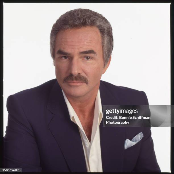 Actor Burt Reynolds wears a suit and looks at camera in Florida in 1989.