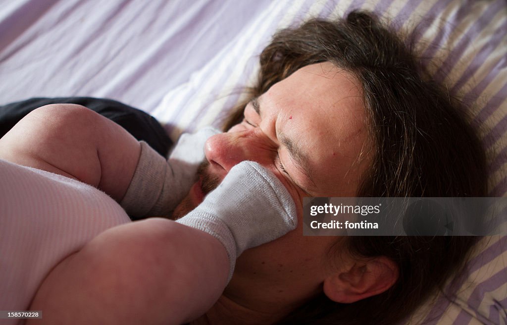 Father playing with her daughter