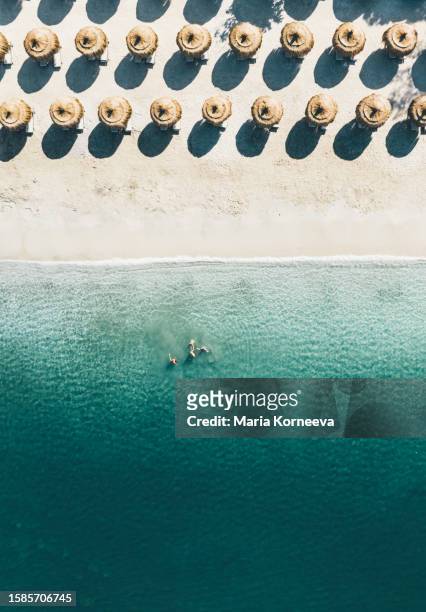 aerial view of umbrellas in a beach. - see through shoe stock pictures, royalty-free photos & images
