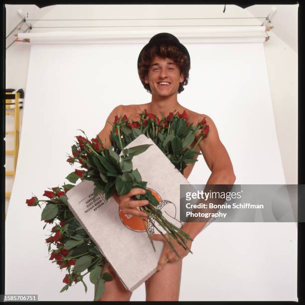 Actor Patrick Dempsey poses nude covering himself with a bunch of roses and an extra large card for "Loverboy" in Los Angeles in 1988.