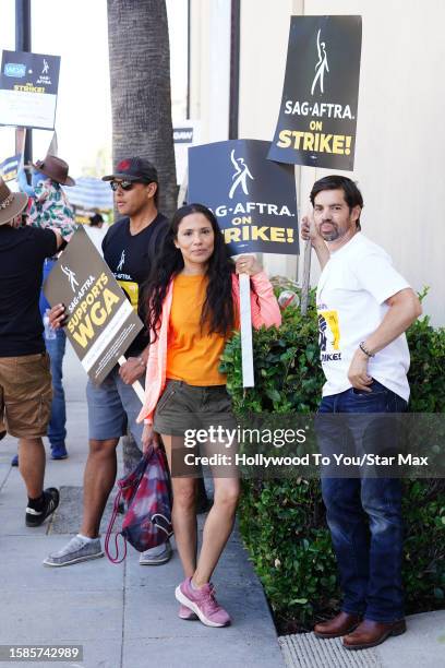 Tonantzin Carmelo, Cody Jones and Matthew C. Ryan walk the picket line in support of the SAG-AFTRA and WGA strike at Warner Bros. Studios in Burbank...