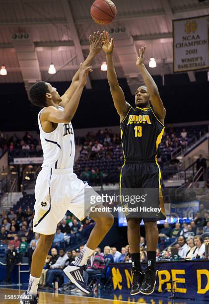 Jordan Montgomery of the Kennesaw State Owls shoots the ball against Cameron Biedscheid of the Notre Dame Fighting Irish at Purcel Pavilion on...