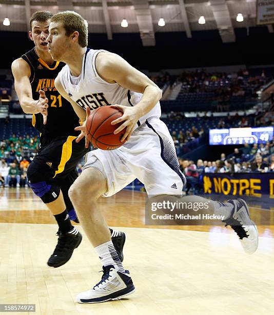 Scott Martin of the Notre Dame Fighting Irish dribbles the ball along the baseline as Aaron Anderson of the Kennesaw State Owls defends at Purcel...