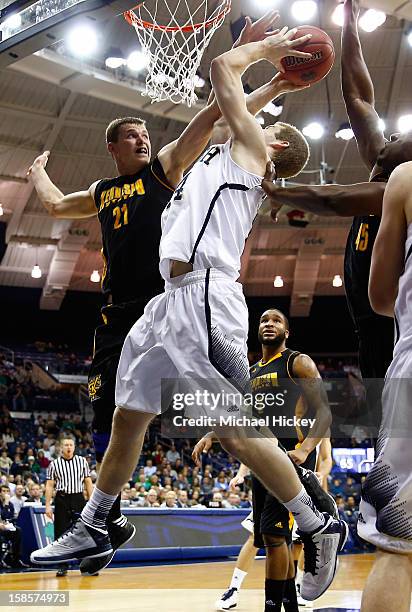 Aaron Anderson of the Kennesaw State Owls tries to block the shot of Scott Martin of the Notre Dame Fighting Irish at Purcel Pavilion on December 19,...