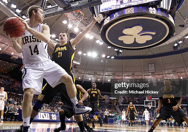 Scott Martin of the Notre Dame Fighting Irish tries to keep the ball inbounds as Aaron Anderson of the Kennesaw State Owls defends at Purcel Pavilion...