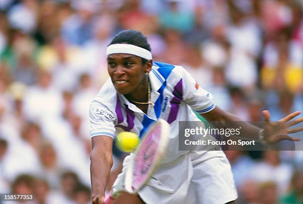 Zina Garrison of the USA returns a shot during the Women's singles at the Wimbledon Lawn Tennis Championships circa 1990 at the All England Lawn...