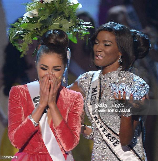 Miss USA, Olivia Culpo reacts after being named Miss Universe 2012 beside last year's winner Leila Lopes of Angola during the Miss Universe Pageant...