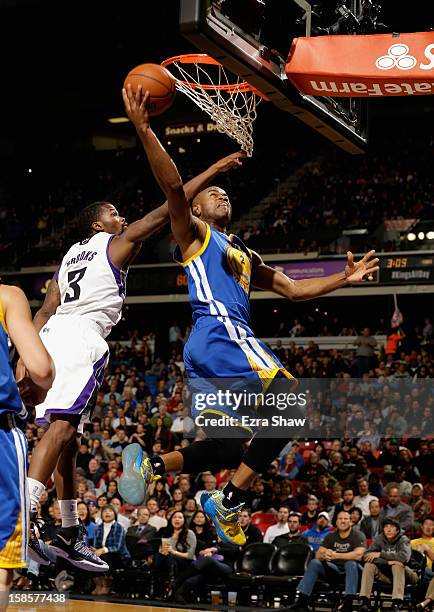 Jarrett Jack of the Golden State Warriors goes up for a shot against Aaron Brooks of the Sacramento Kings at Sleep Train Arena on December 19, 2012...