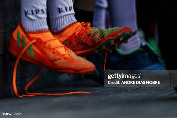Young player's sneakers with the signatures of the Portugal's National Rugby Team players are pictured during a training session of the Direito's...
