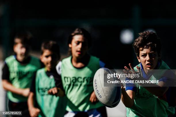 Young players in action during a training session of the Direito's Summer Academy 2023 in Lisbon, on July 11, 2023.Grupo Desportivo Direito was...