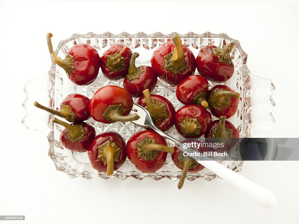 Spicey sweet pickled peppers in a serving dish