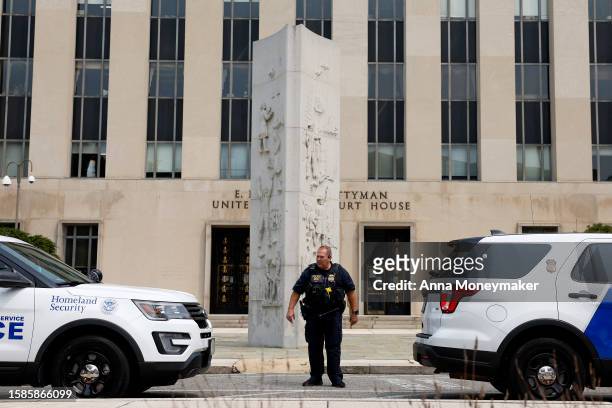 Police officers with the Department of Homeland Security stand in front of the E. Barrett Prettyman U.S. District Court House on August 01, 2023 in...