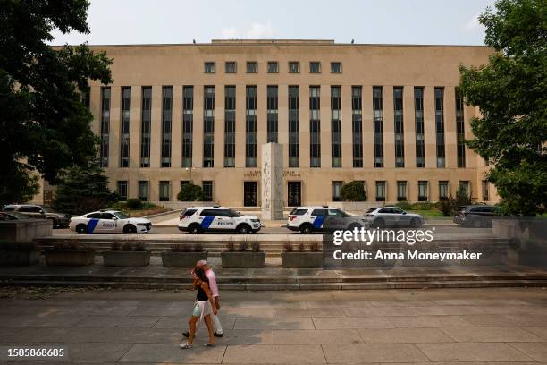 Police officers with the Department of Homeland Security stand in front of the E. Barrett Prettyman U.S. District Court House on August 01, 2023 in...