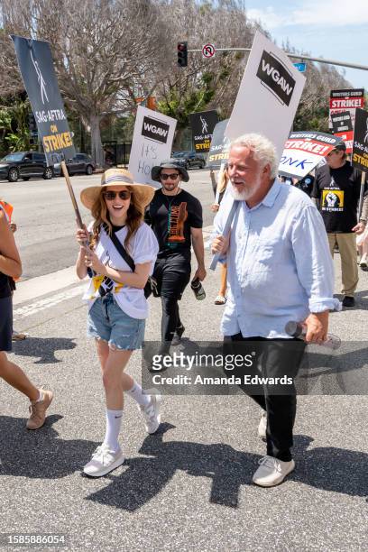Actress Anna Kendrick and writer Larry Karaszewski join members and supporters of SAG-AFTRA and WGA on the picket line at Fox Studios on August 01,...