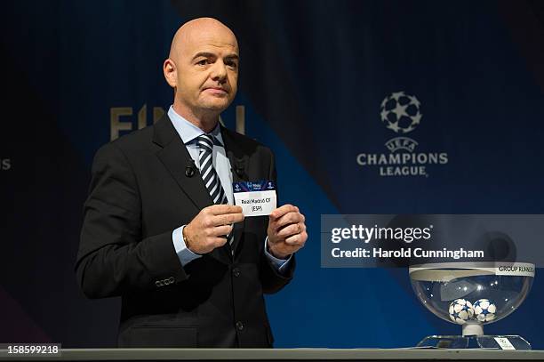 Gianni Infantino, General Secretary of the UEFA, shows the name Real Madrid during the UEFA Champions League round of 16 draw at the UEFA...