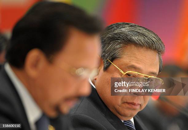 Indonesian President Susilo Bambang Yudhoyono watches as Brunei's Sultan Hassanal Bolkiah speaks during The ASEAN-India Commemorative Summit in New...