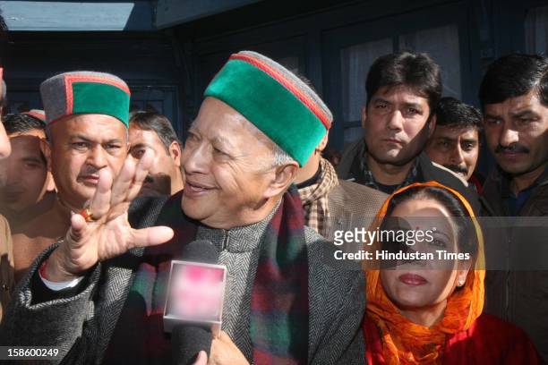 Congress leader Virbhadra Singh with wife Pratibha Singh after Congress Party declared winner in Himachal Pradesh State Assembly Poll 2012, on...