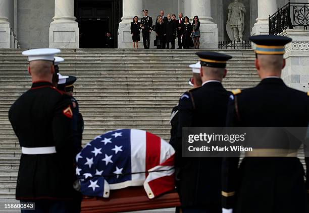 Family members watch as the late Senator Daniel Inouye is carried in a casket up the steps of the U.S. Capitol December 20, 2012 in Washington, DC....