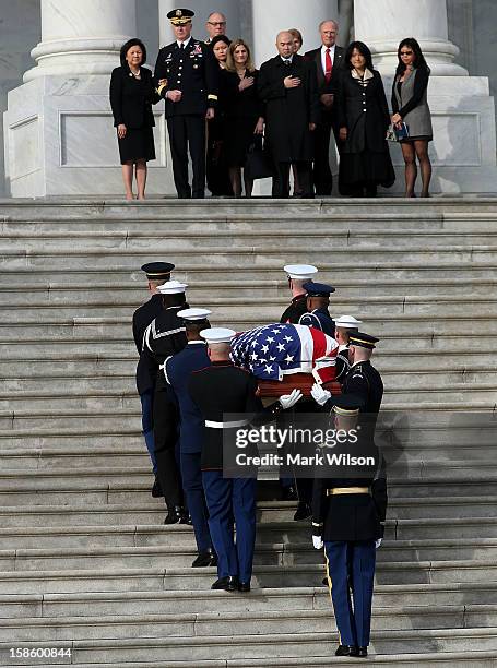 Family members watch as the late Senator Daniel Inouye is carried in a casket up the steps of the U.S. Capitol December 20, 2012 in Washington, DC....