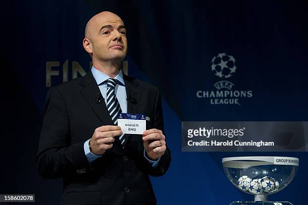 Gianni Infantino, General Secretary of the UEFA, shows the name Arsenal FC during the draw for the last 16 of the UEFA Champions League at the UEFA...