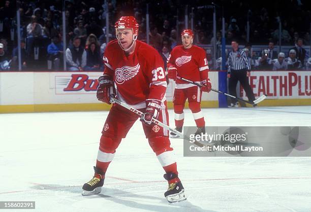 Kris Draper of the Detroit Red Wings looks on during a hockey game against the Washington Capitals on January 13, 1996 at USAir Arena in Landover,...