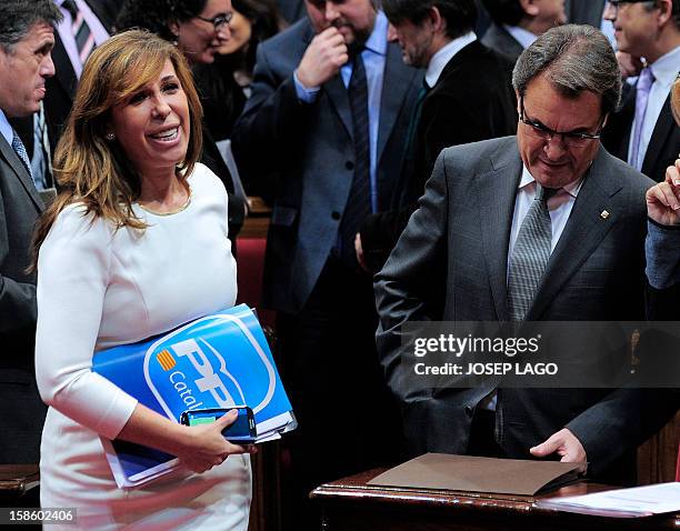 Popular Party leader of the Catalonia region Alicia Sanchez Camacho walks next to Incoming president of the Catalan government Artur Mas during an...