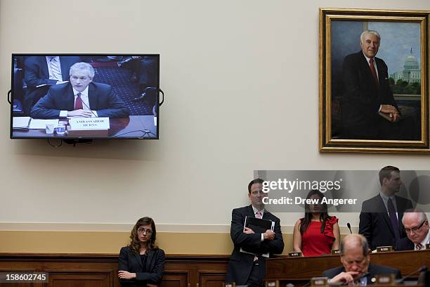Congressional staffers listen as Deputy Secretary of State William Burn testifies during the House Foreign Affairs Committee on the September 11th...