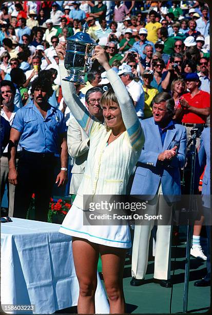 Chris Evert-Lloyd holds up the championship trophy after she defeated Hana Mandlikova of Czecholovakia in the women's finals 5-7,6-1,6-1 during the...