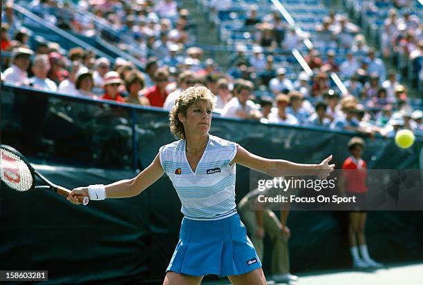 Chris Evert-Lloyd returns a shot during the Women's 1984 US Open Tennis Championships circa 1984 at the USTA Tennis Center in the Queens borough of...