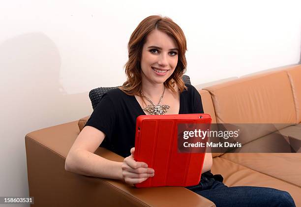 Actress Emma Roberts plays , a mobile game from The Coca-Cola Company and to help deliver an AIDS FREE GENERATION on December 20, 2012 in Los...